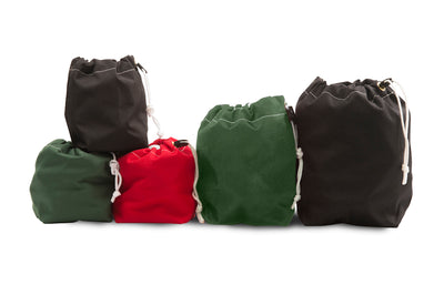 Five drawstring bags in black, green, and red on a white background